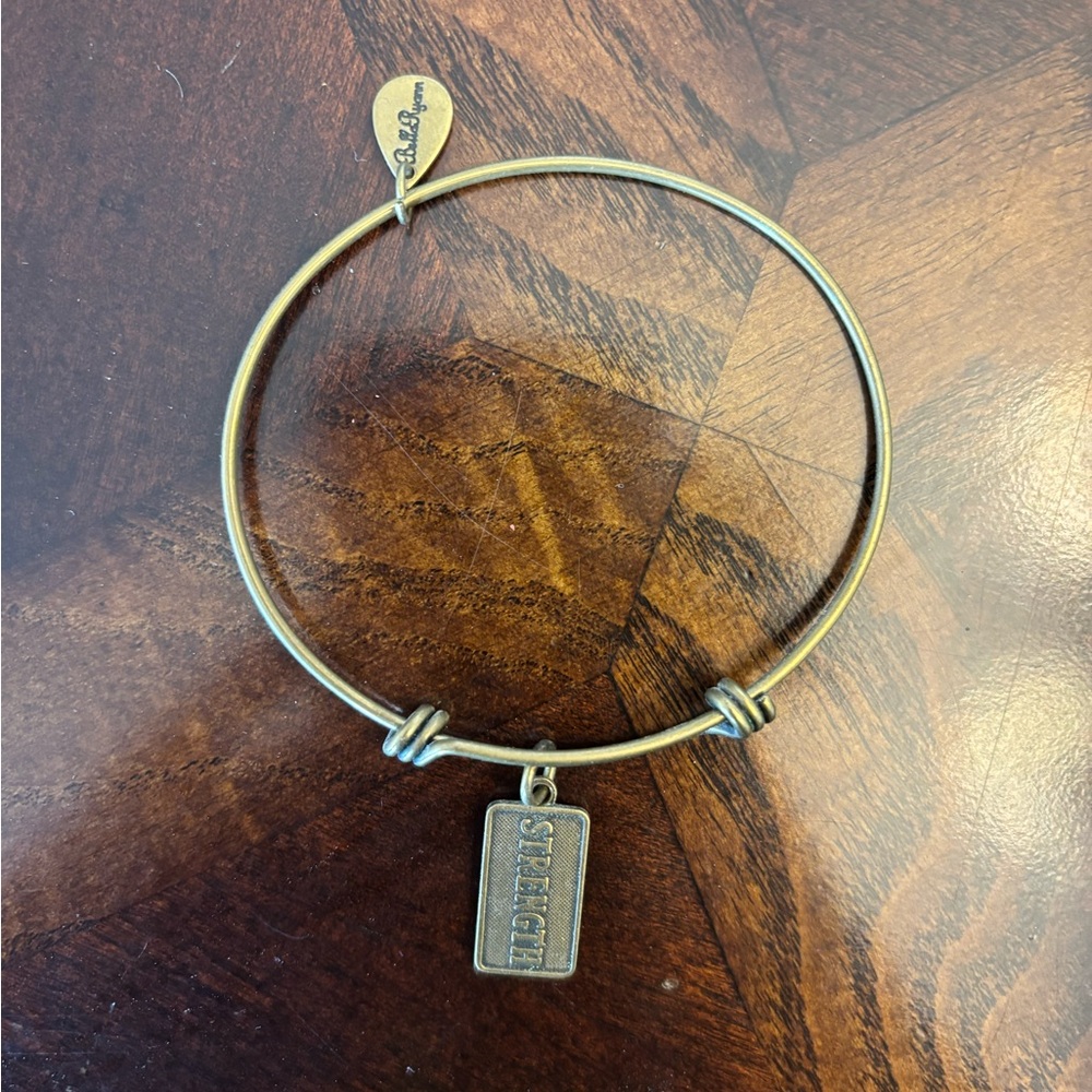 Gold Bangle Bracelet with Strength Charm Bella Ryann